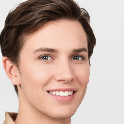 Joyful white young-adult female with short  brown hair and grey eyes