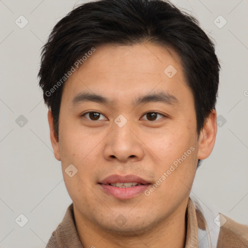 Joyful asian young-adult male with short  brown hair and brown eyes