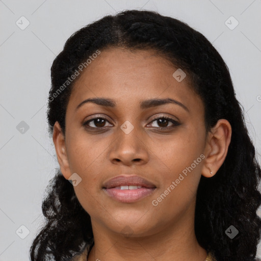 Joyful black young-adult female with long  black hair and brown eyes