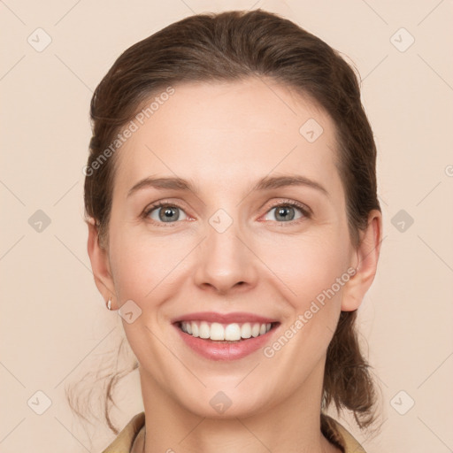 Joyful white young-adult female with medium  brown hair and grey eyes