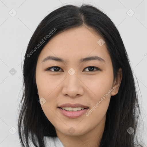 Joyful asian young-adult female with long  brown hair and brown eyes