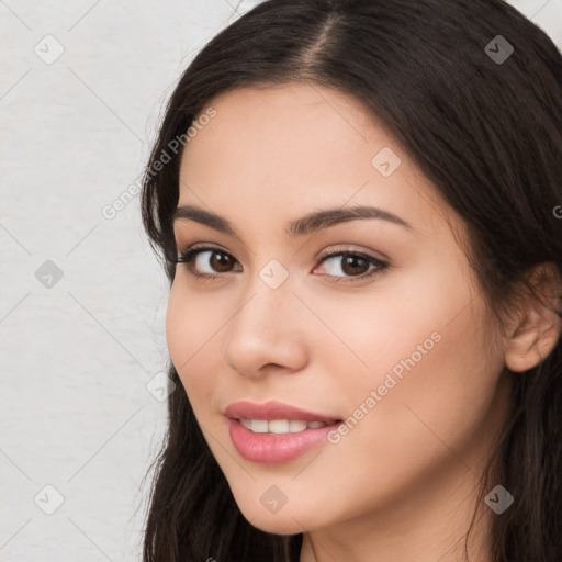 Neutral white young-adult female with long  brown hair and brown eyes