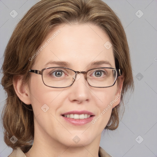 Joyful white adult female with medium  brown hair and blue eyes