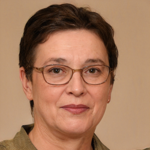 Joyful white middle-aged female with medium  brown hair and grey eyes