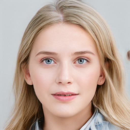 Joyful white young-adult female with long  brown hair and blue eyes