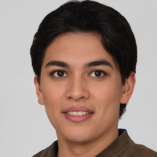 Joyful asian young-adult male with short  black hair and brown eyes