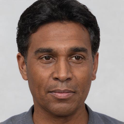 Neutral black adult male with short  black hair and brown eyes