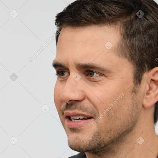 Joyful white adult male with short  brown hair and brown eyes