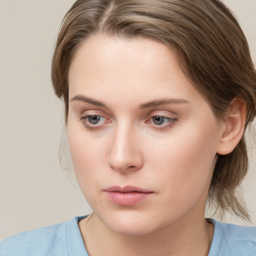 Neutral white young-adult female with medium  brown hair and grey eyes