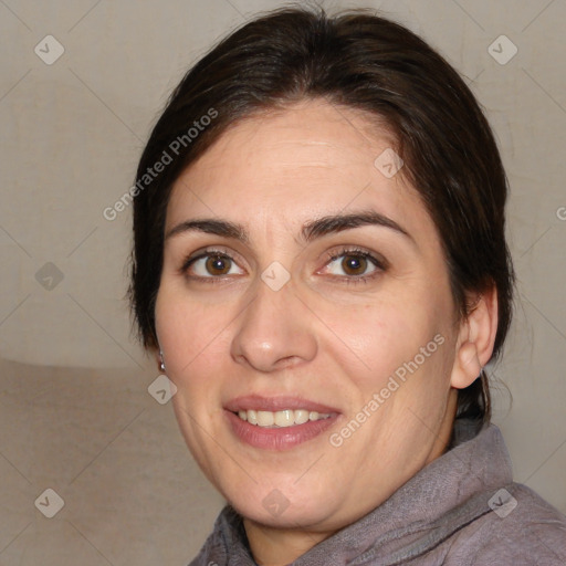 Joyful white adult female with medium  brown hair and brown eyes