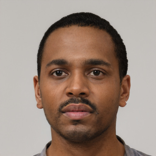 Neutral black young-adult male with short  black hair and brown eyes