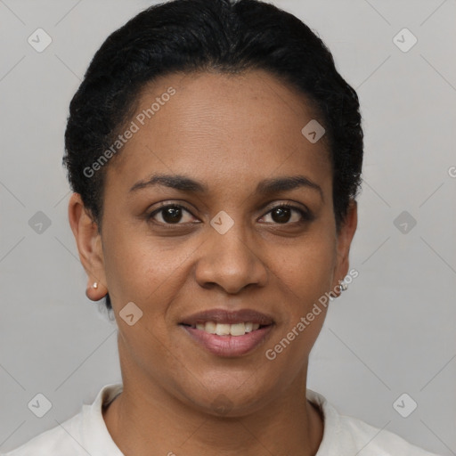 Joyful black young-adult female with short  black hair and brown eyes