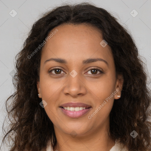 Joyful black young-adult female with long  brown hair and brown eyes