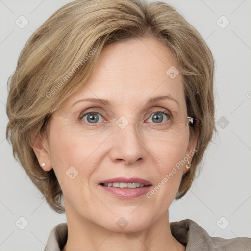 Joyful white adult female with medium  brown hair and grey eyes