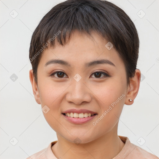 Joyful asian young-adult female with short  brown hair and brown eyes