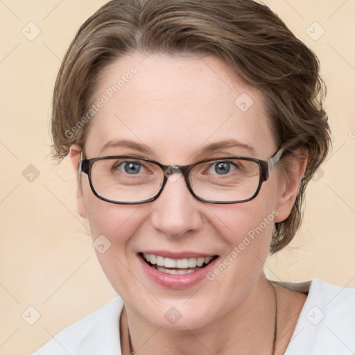 Joyful white adult female with medium  brown hair and blue eyes