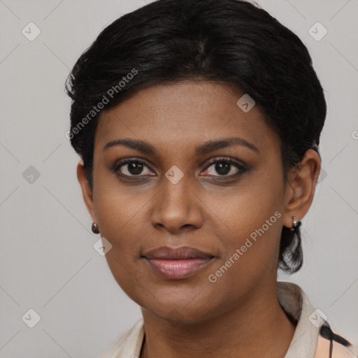 Joyful black young-adult female with short  black hair and brown eyes