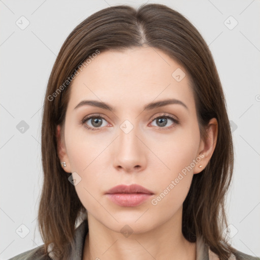 Neutral white young-adult female with long  brown hair and brown eyes