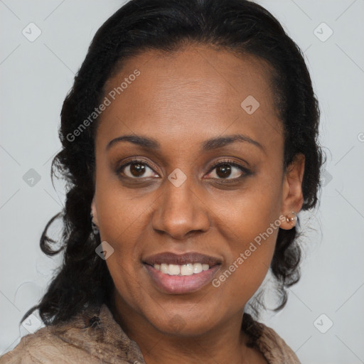 Joyful black young-adult female with long  brown hair and brown eyes