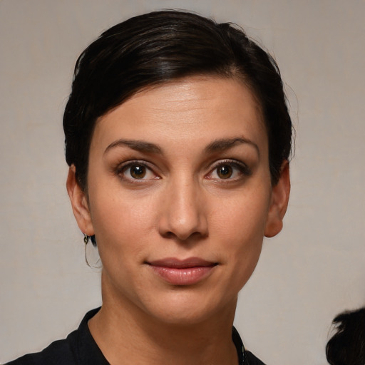 Joyful white young-adult female with short  brown hair and brown eyes