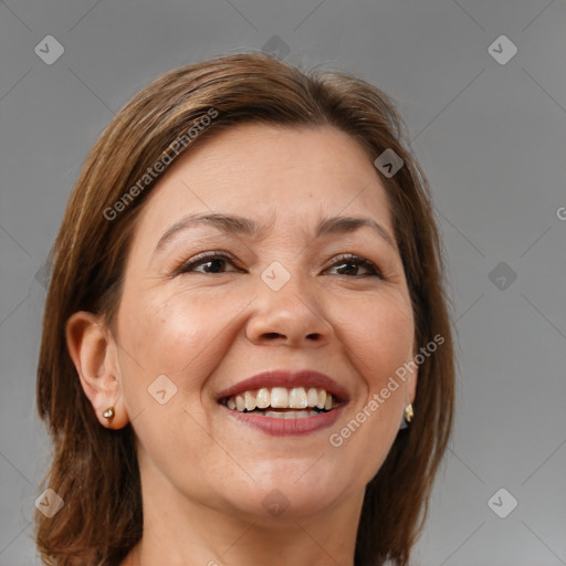 Joyful white adult female with medium  brown hair and brown eyes