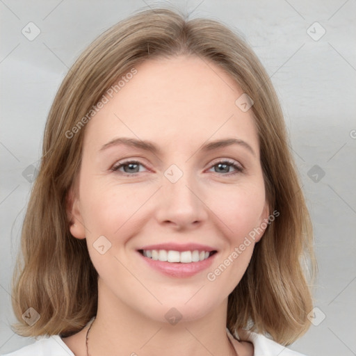 Joyful white young-adult female with medium  brown hair and blue eyes