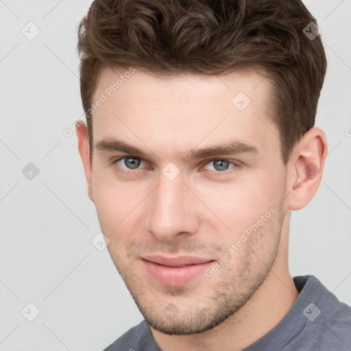 Neutral white young-adult male with short  brown hair and grey eyes