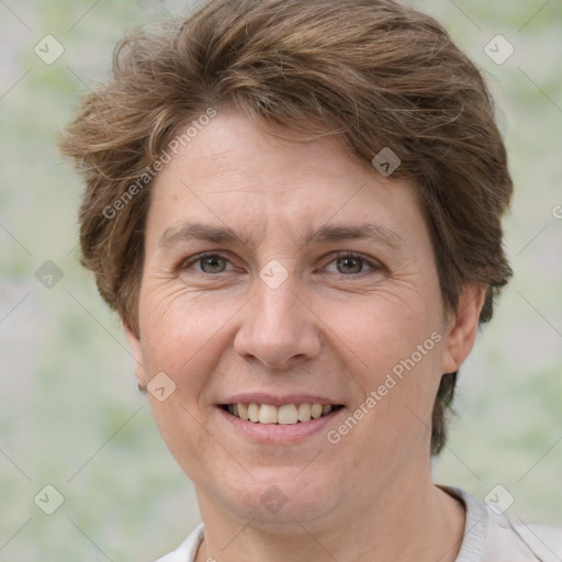 Joyful white adult female with short  brown hair and brown eyes