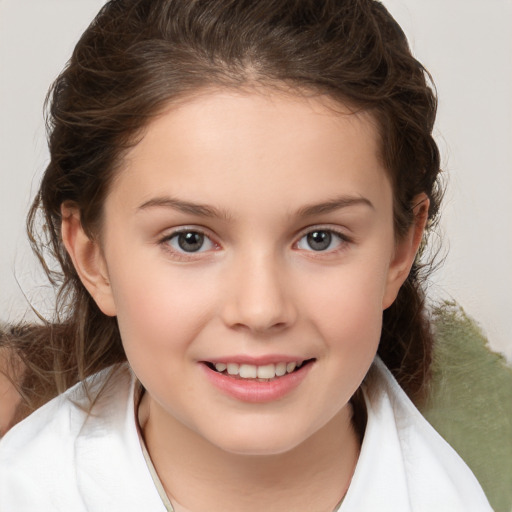 Joyful white child female with medium  brown hair and brown eyes