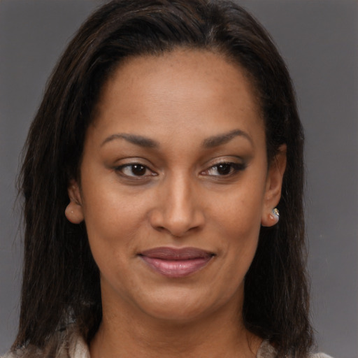 Joyful black young-adult female with medium  brown hair and brown eyes