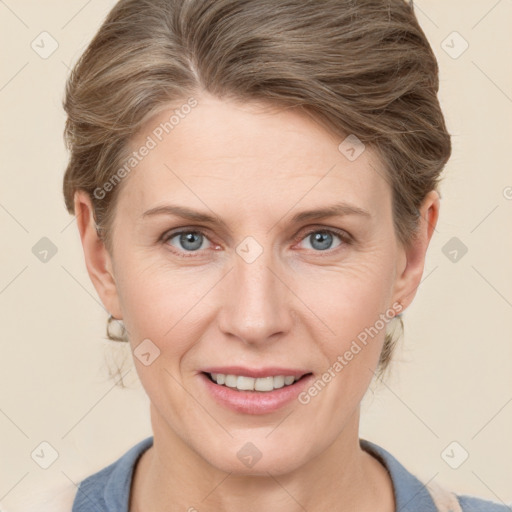 Joyful white adult female with short  brown hair and grey eyes