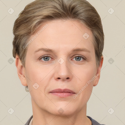 Joyful white adult female with short  brown hair and grey eyes