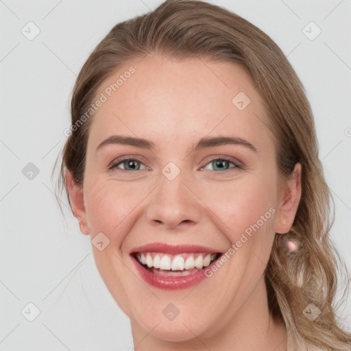 Joyful white young-adult female with medium  brown hair and blue eyes