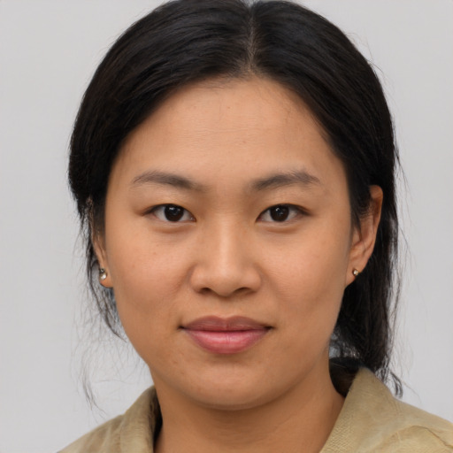 Joyful asian young-adult female with medium  brown hair and brown eyes