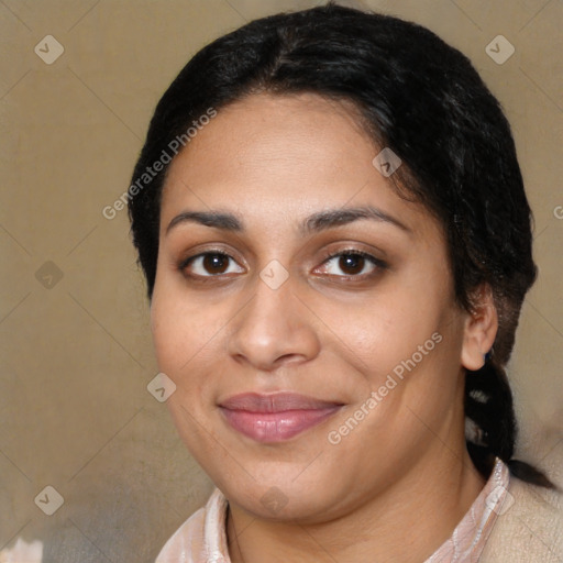 Joyful latino young-adult female with medium  brown hair and brown eyes