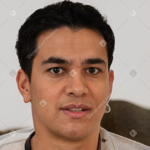 Joyful latino young-adult male with short  brown hair and brown eyes