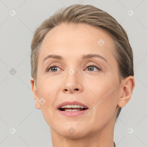 Joyful white adult female with short  brown hair and brown eyes