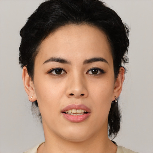 Joyful asian young-adult female with medium  black hair and brown eyes
