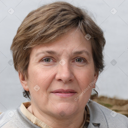 Joyful white adult female with short  brown hair and grey eyes