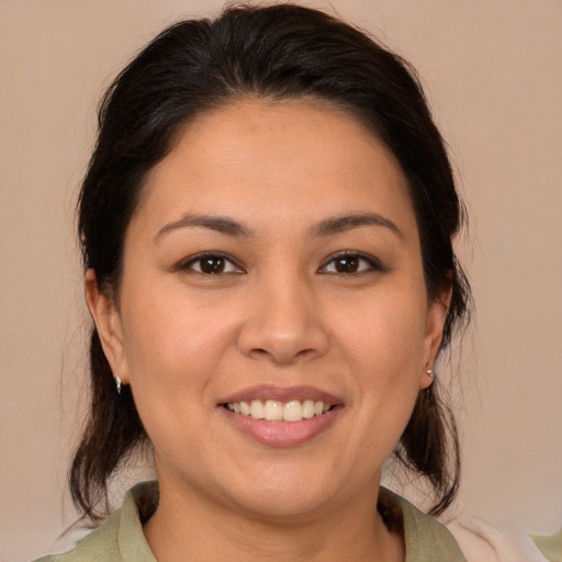 Joyful white young-adult female with medium  brown hair and brown eyes