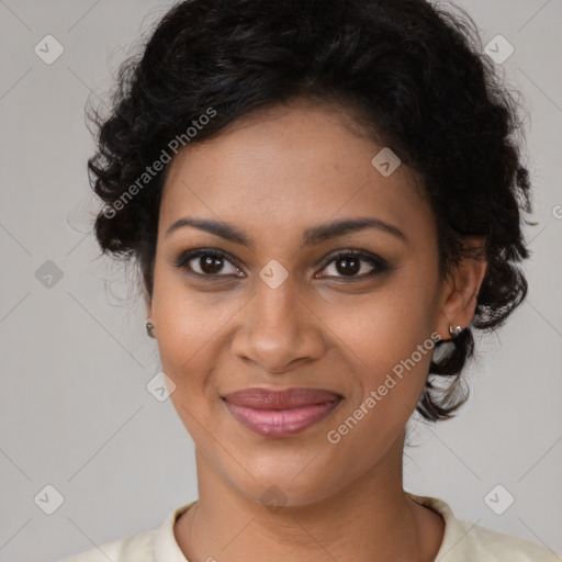 Joyful black young-adult female with medium  brown hair and brown eyes