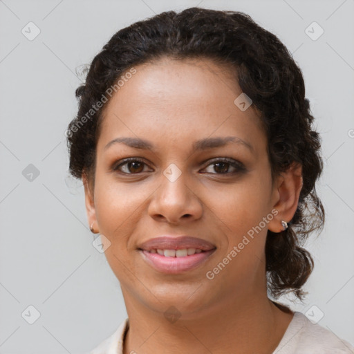 Joyful black young-adult female with short  brown hair and brown eyes
