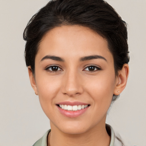 Joyful white young-adult female with long  brown hair and brown eyes