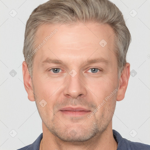 Joyful white adult male with short  brown hair and grey eyes