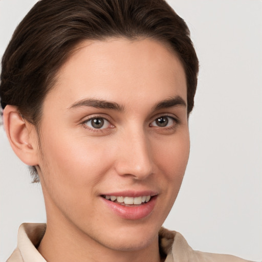 Joyful white young-adult female with short  brown hair and brown eyes