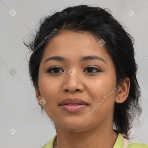 Joyful latino young-adult female with medium  brown hair and brown eyes