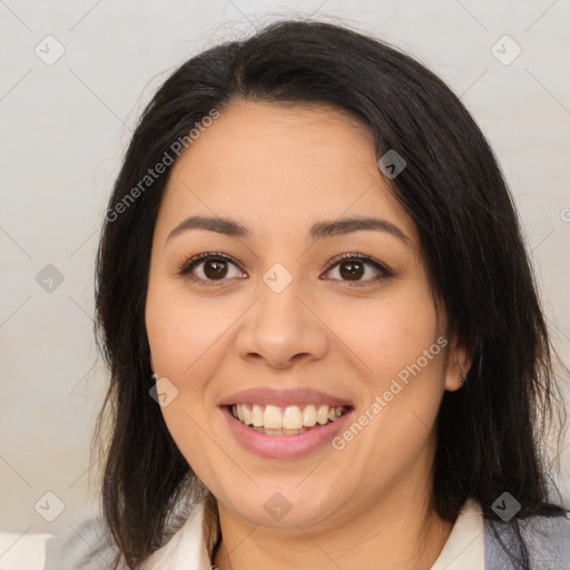 Joyful latino young-adult female with medium  brown hair and brown eyes