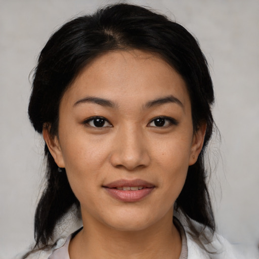 Joyful asian young-adult female with medium  black hair and brown eyes