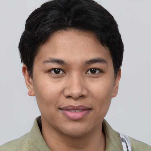 Joyful asian young-adult female with short  brown hair and brown eyes