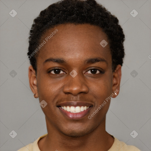 Joyful black young-adult male with short  brown hair and brown eyes